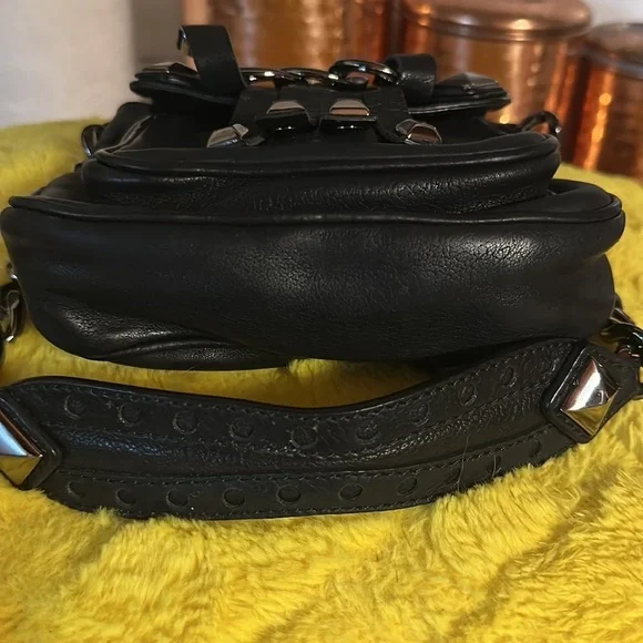 As seen in Vogue. Michael kors 2006 collection. Black studded leather.